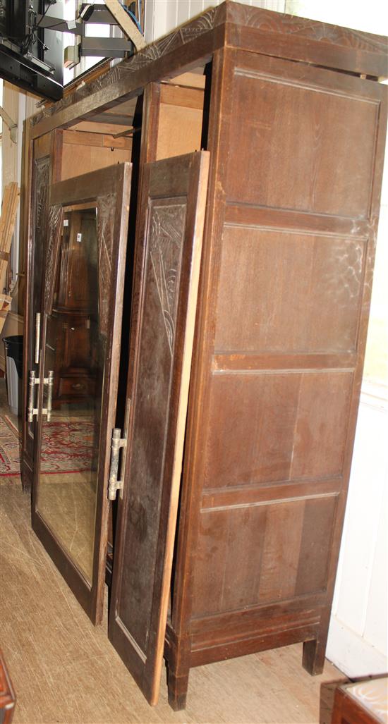 Carved oak mirrored armoire